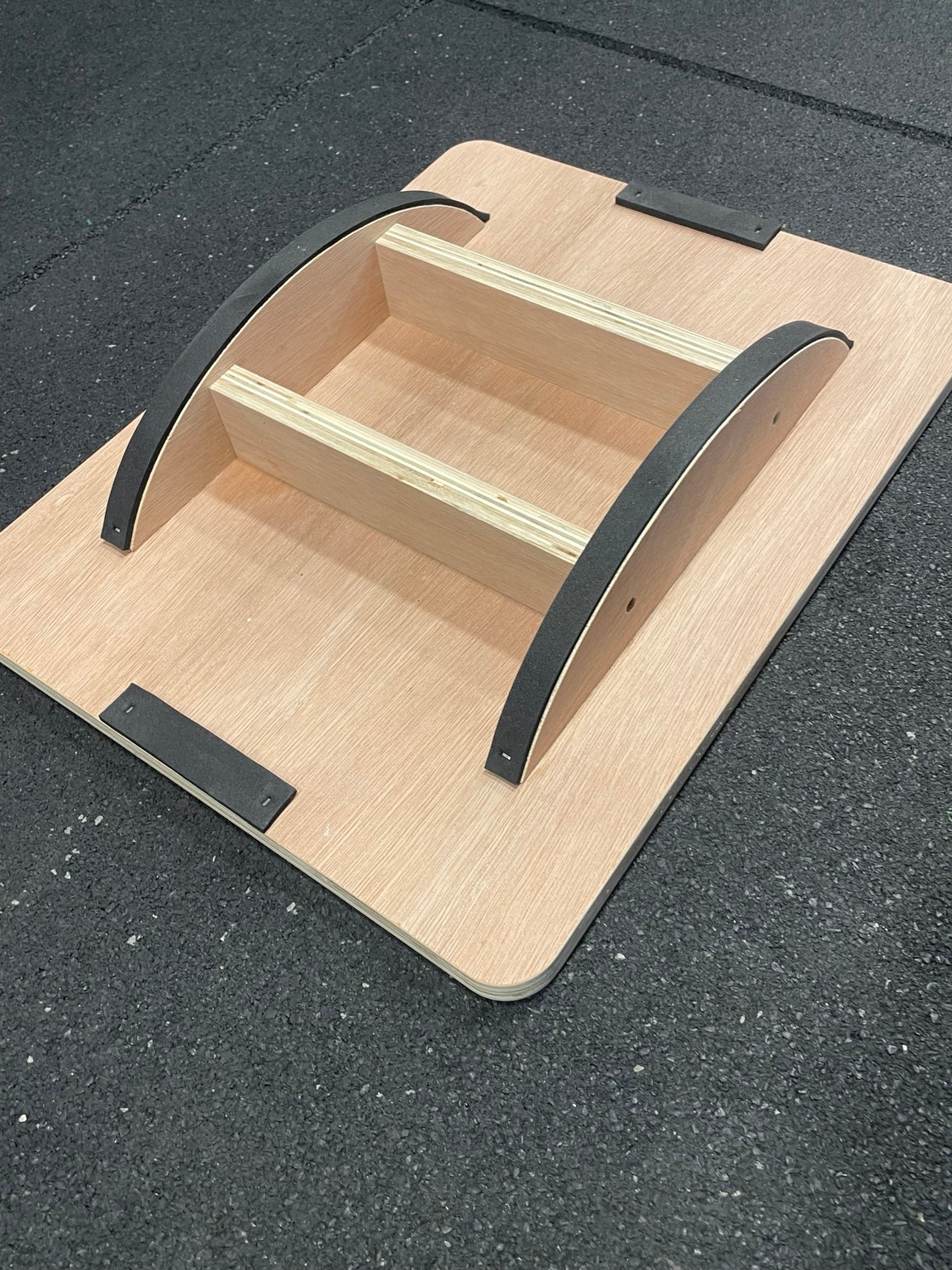 Curved rocker base of wooden balance board