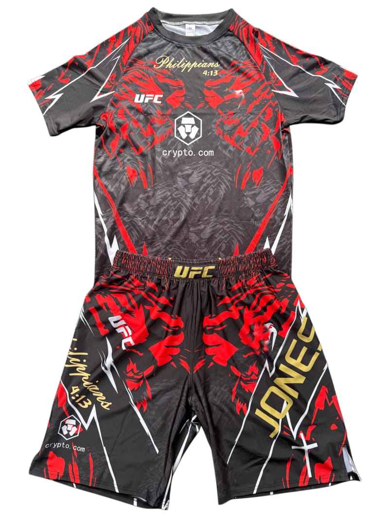 Black and red printed MMA training shirt and shorts set on a white background