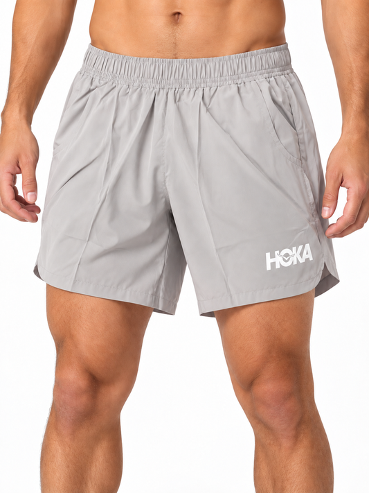Men's grey HOKA running shorts on model