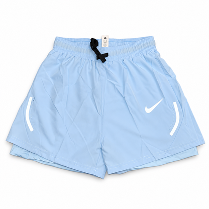 Light blue Nike Athletic Shorts on white background