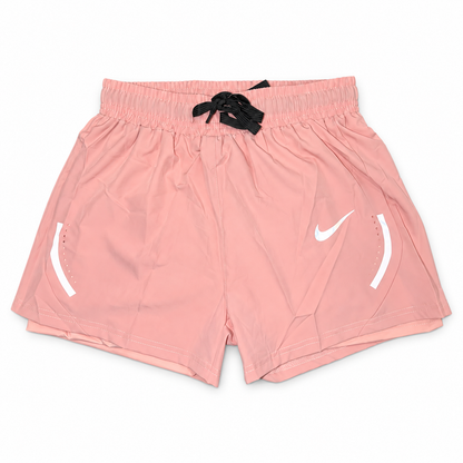 Pink Nike Athletic Shorts on white background