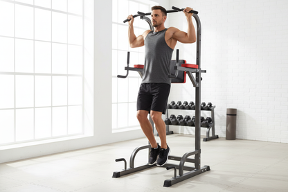 Person doing pull-ups on a power tower